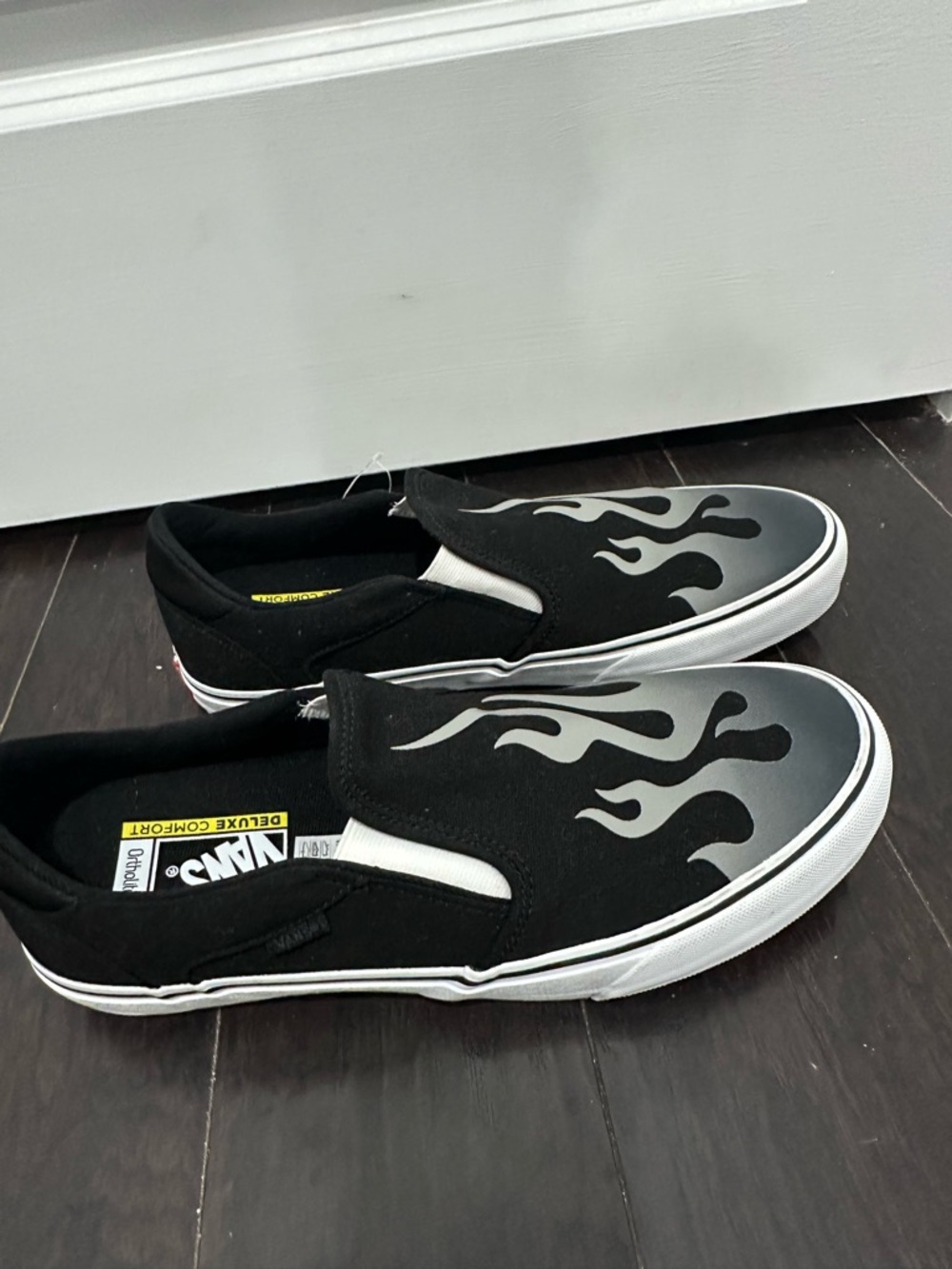 NWOT Vans Slip-On Sneakers Men’s  SZ 12 with Silver Flame Graphic on Black